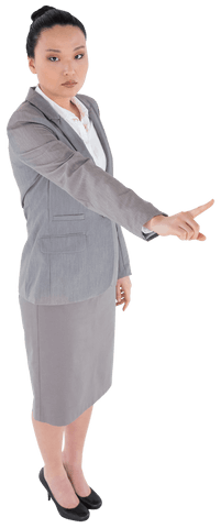 Serious asian businesswoman pointing with authority on transparent background