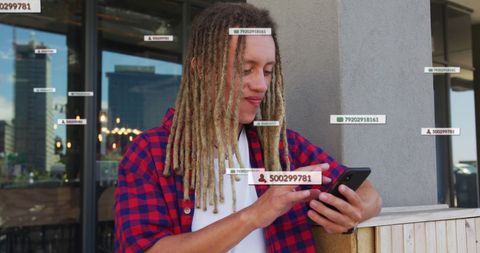 Young Man Engaging with Social Media Through Smartphone Outdoors