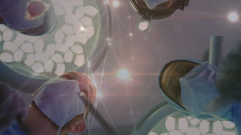 Surgeons Collaborating Under Dramatic OR Lights