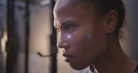 Focused athlete exhibiting determination in gym setting