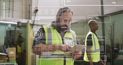 Technician Analyzing Digital Data in Modern Factory Environment