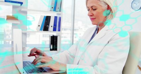 Female Scientist Analyzing Data on Laptop with Digital Graphic Overlay