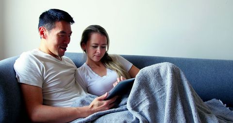 Couple Relaxing with Tablet on Sofa - Download Free Stock Images Pikwizard.com