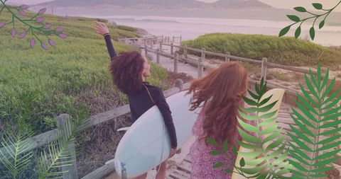 Diverse female surfers enjoying coastal walk with boards