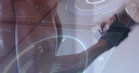 Muscular male gripping weight with wrist strap and futuristic hud overlay, strength training