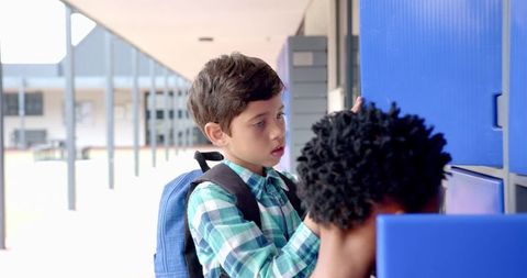 Young Students Exploring Lockers at School Together