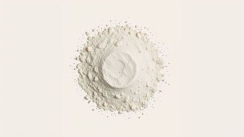 Mound of milk powder on cream surface minimalist design