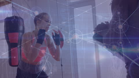 Female Boxer Training with Coach in Digital Innovation Environment