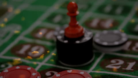Roulette Table with Winning Chips and Ball in Casino Setting