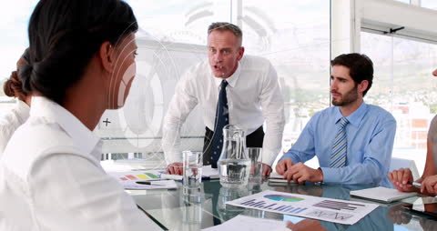 Intense Business Meeting with Financial Data Overlays