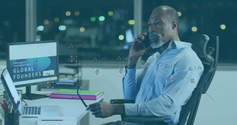 Businessman Analyzing Digital Financial Data in Office at Night