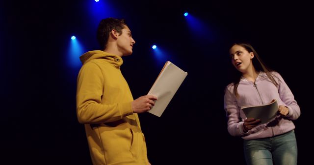 Teenagers Rehearsing Play on Stage Under Dramatic Lighting - Download Free Stock Images Pikwizard.com