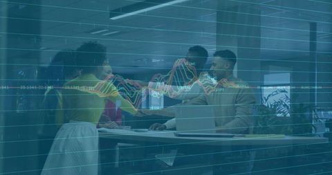 Diverse Office Team Collaborating Over Data Analytics Dashboard Showing Financial Trends