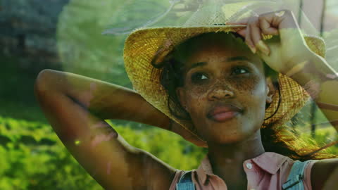 Dreamy Farmer Adjusting Sun Hat in Field