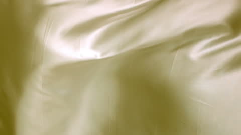 Flowing Yellow Silk Fabric in Motion