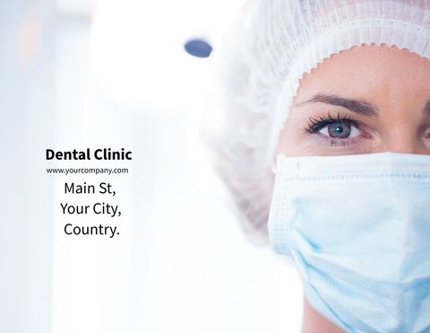 Close-up of professional dentist in surgical mask