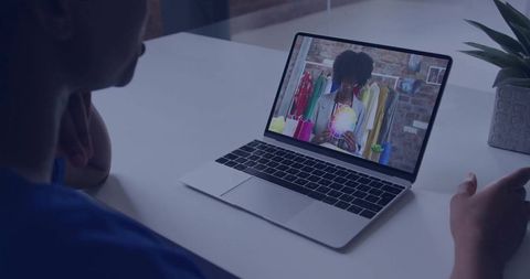 Fashion Designer Video Conference with Swatch Review on Laptop Screen