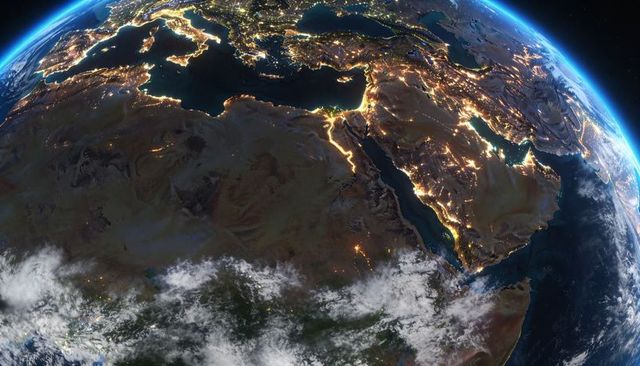 Earth at night showing nile delta, suez canal and arabian peninsula lit by city lights
