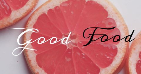 Good food concept with fresh grapefruit slices on white