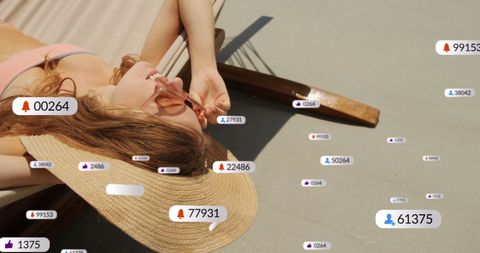 Social Media Icons Surrounding Woman Sunbathing at Beach