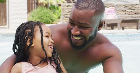 Father and Daughter Enjoying Quality Time in Pool