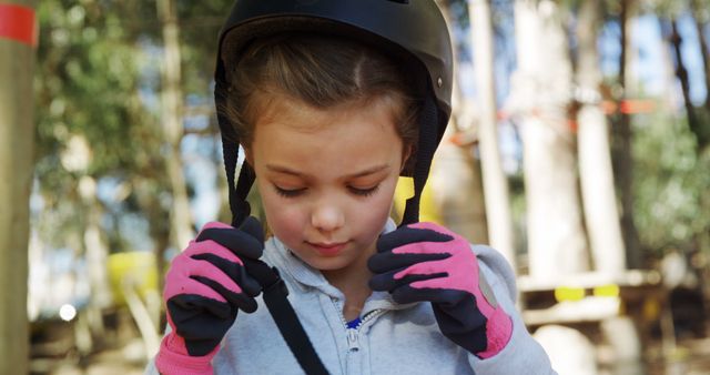 Young Girl Preparing for Outdoor Adventure with Helmet - Download Free Stock Images Pikwizard.com