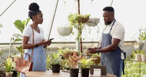 Customer and Vendor Experiencing Digital Payment in Greenhouse