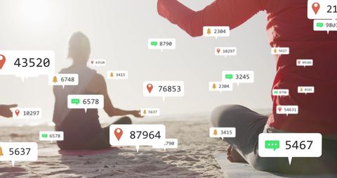 Social Media Alerts Overlay on Beach Yoga Session Symbolizing Connectivity