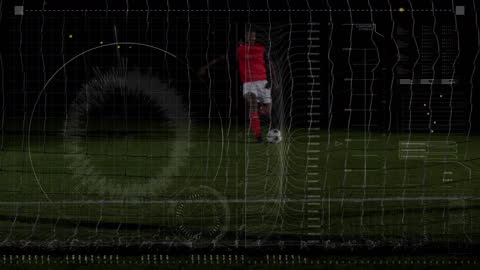 Soccer Player Engaging with Digital Data Interface on Field