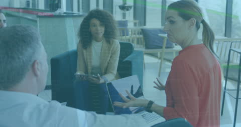 Diverse Colleagues Discussing Data Processing in Modern Office