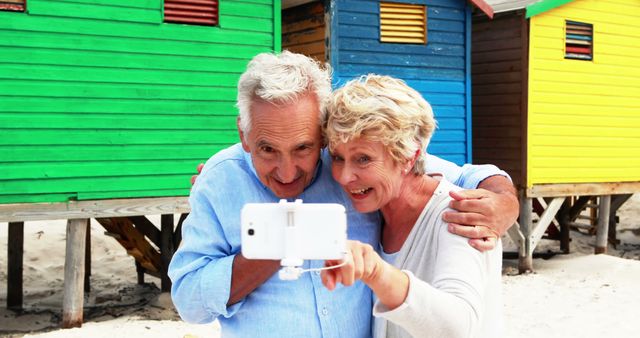 Senior Couple Taking Selfie at Colorful Beach Houses - Download Free Stock Images Pikwizard.com