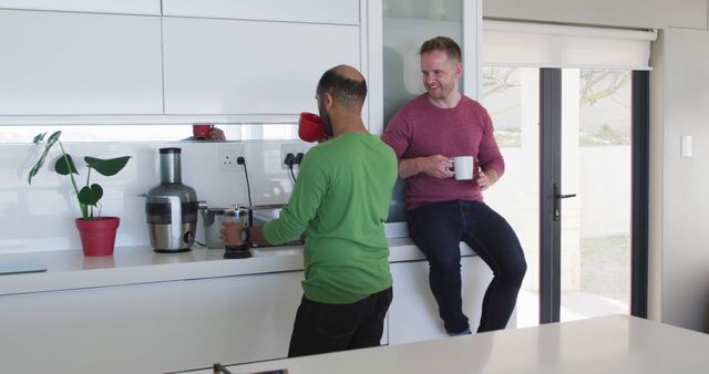 Friends Conversing in Modern Kitchen with Coffee Cups - Download Free Stock Images Pikwizard.com