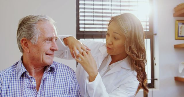 Healthcare Professional Assisting Elderly Patient at Clinic - Download Free Stock Images Pikwizard.com