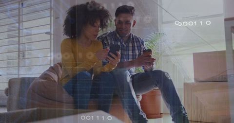 Couple Bonding Over Smartphone with Coffee in New Home