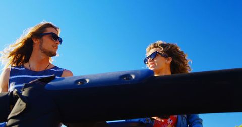 Friends Enjoying Convertible Ride at Beach on Sunny Day