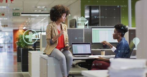 Diverse Women Collaborating in Modern Office with Digital Interface - Download Free Stock Images Pikwizard.com