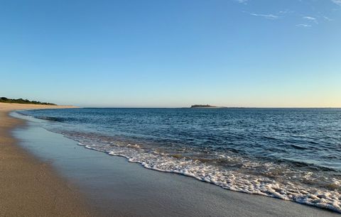 Serene Beach Landscape at Sunset with Calm Waves