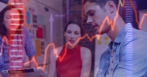 Team Analyzing Data with Graph Overlay Visualizing Trends