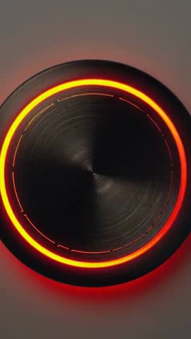 Animating metallic control knob powering on with sweeping amber LED ring vertical video