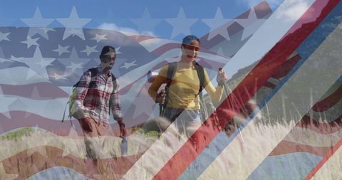 Diverse Couple Hiking with American Flag Overlay Celebrating Patriotism