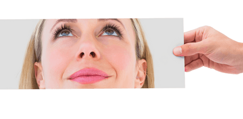 Transparent View: Hand Holding Across Female Expression Close-Up