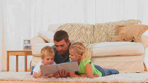 Father Engaging in Shared Reading with His Children