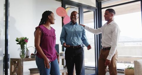 Colleagues Celebrating Farewell Party with Balloons in Office