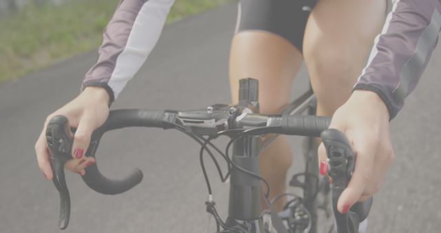 Close up of mid section of asian woman riding bike - Download Free Stock Photos Pikwizard.com