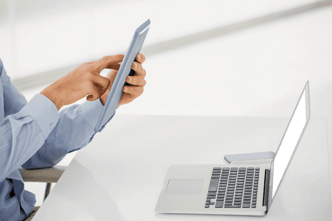Businessman Interacting with Transparent Digital Tablet at Desk - Download Free Stock Videos Pikwizard.com