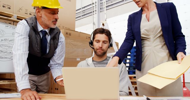 Manager and Warehouse Worker Discussing Logistics at Computer with Marketing Manager - Download Free Stock Images Pikwizard.com