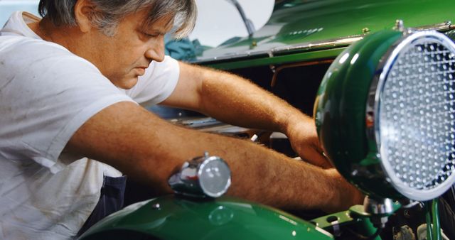 Mechanic Repairing Classic Vintage Car In Garage - Download Free Stock Images Pikwizard.com