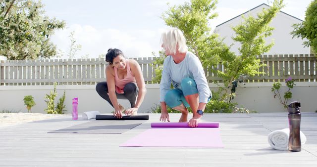 Women Preparing Yoga Mats Outdoor for Fitness Session - Download Free Stock Images Pikwizard.com