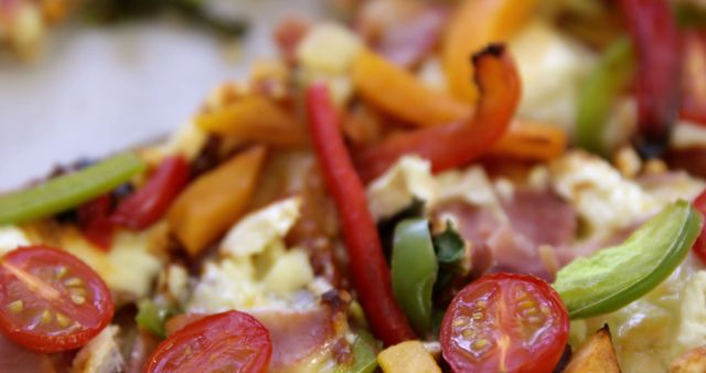 This image shows a close-up of a vegetable pizza slice, with toppings like cherry tomatoes, red and green bell peppers, and melted cheese. Perfect for use in food blogs, restaurant menus, advertisements for pizzerias, and healthy eating campaigns.