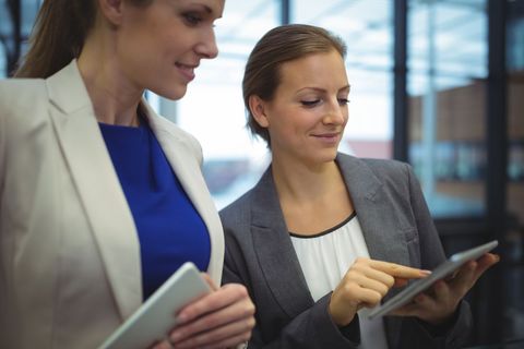 Business Executives Collaborating on Tablet in Modern Office - Download Free Stock Images Pikwizard.com
